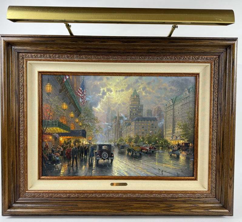 Thomas Kinkade Giclee Limited Edition Framed Print: Thomas Kinkade Giclee Limited Edition Framed Print. This is from a single owner collection of eight Thomas Kinkade's featured in this auction. Titled New York Fifth Avenue. Quality framed, measures