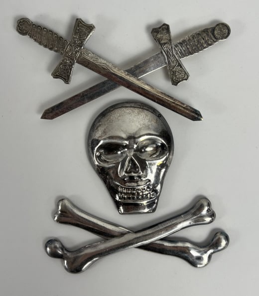 Antique Masonic Silver Skull & Cross Bones: Antique Masonic Silver Skull & Cross Bones. Together with a pair of swords. Coin silver or silver plate, tests below sterling grade. Skull measures 3.25 x 2.5 inches. Swords measure 5.5 inches in leng