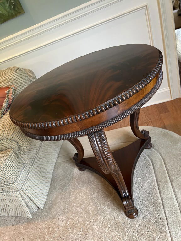 Quality Neo Classical Design Mahogany End Table: Quality Neo Classical Design Mahogany End Table. Featuring scroll design legs with acanthus leaf stylized carving. Top with crotch mahogany and carved border. Measures 29 x 30 inches.