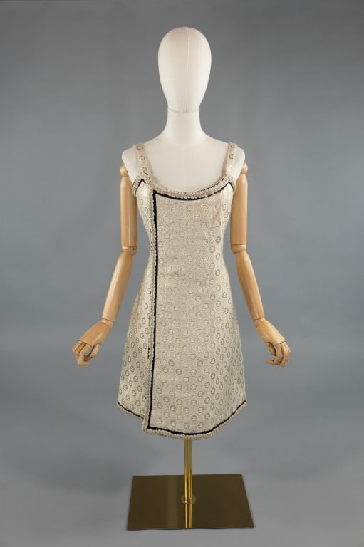 Vintage 1960s Chanel Couture Gold Lame Dress: Vintage 1960s Chanel Couture Gold Lame CC Logo Dress. Wool with lame thread weave. Braided details throughout. Lined in silk. Closes with zip at back. Unlabeled but likely circa Autumn/Winter 1965/66.