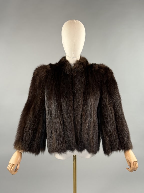 Vintage 1940s Brown Beaver Fur Coat Jacket: Vintage 1940s Brown Beaver Fur Coat Jacket. With puffed shoulders and bell sleeves. Two small pockets at side, one with light wear as shown. Hooks up center front to close. Fully lined with straps