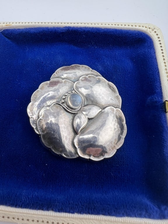 Estate Georg Jensen Pansy Moonstone Brooch: Estate Georg Jensen Pansy Moonstone Brooch. Sterling silver and moonstone, signed and hallmarked on the back. Style number 113. Measures approximately 1.75 x 1.5 inches.