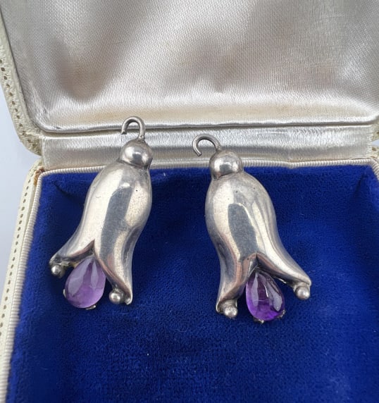 Pair Vintage William Spratling Sterling Earrings: Pair of Vintage William Spratling Sterling Earrings.Each set with a cabochon amethyst. Back of one is stamped silver and made in Mexico. Each measures approximately 1.5 inches in length.
