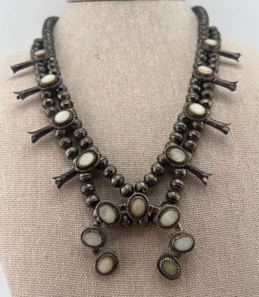 Vintage Native American Sterling Squash Blossom: Vintage Native American Sterling Squash Blossom Necklace. Navajo pearls and mother of pearl. Squash blossom pendant. Measures 25 inches in length, plus the pendant.