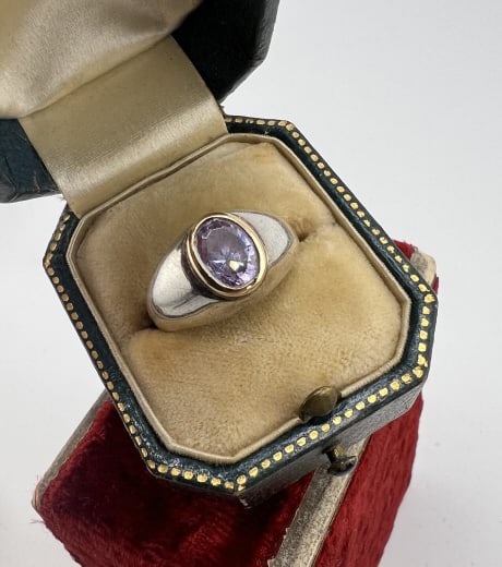 Estate 18kt Yellow Gold Sterling & Blue Topaz Ring: Estate 18kt Yellow Gold Sterling & Blue Topaz Ring. Hallmarked 18k and 925. Bezel set 18kt yellow gold with oval blue topaz. Ring size 5 approximately