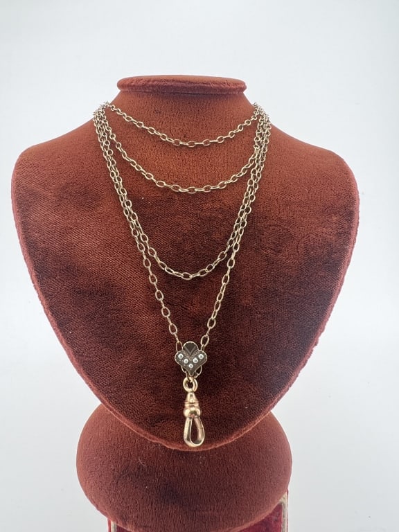Antique 19th C Victorian 10KT Gold Slide Necklace: Antique 19th C Victorian 10KT Gold Slide Necklace.Late 19th C yellow gold filled necklace or watch guard chain with a 10 KT gold and seed pearl slide as well as a dog clip that is marked "HDM & Co." T