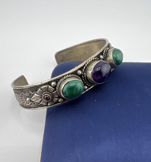 Chinese or Southeast Asian Amethyst Malachite Cuff: Chinese or Southeast Asian Amethyst Malachite Cuff Bracelet. Bezel set with cabochon amethyst and a pair of malachite. Measures 2.5 inches across the interior opening, slightly adjustable in size.