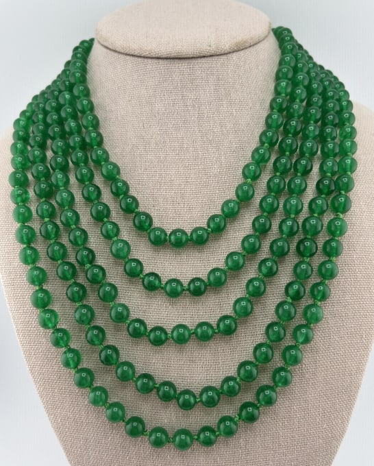 Hand Knotted 104 Inch Chinese Jade Necklace: Impressive Hand Knotted 104 Inch Chinese Jade Necklace Strand. Hand knotted on green silk thread. Tests as Nephrite on the Presidium. Measures approximately 104 inches in length.