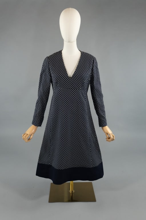 Vintage 1960s Geoffrey Beene Polka Dot Dress: Vintage 1960s Geoffrey Beene Blue & White Polka Dot A-Line Mod Dress. V neckline with zip closure down center back. Long sleeves zip closed at cuffs. Contrast solid blue band at hem. Measures 36 inch