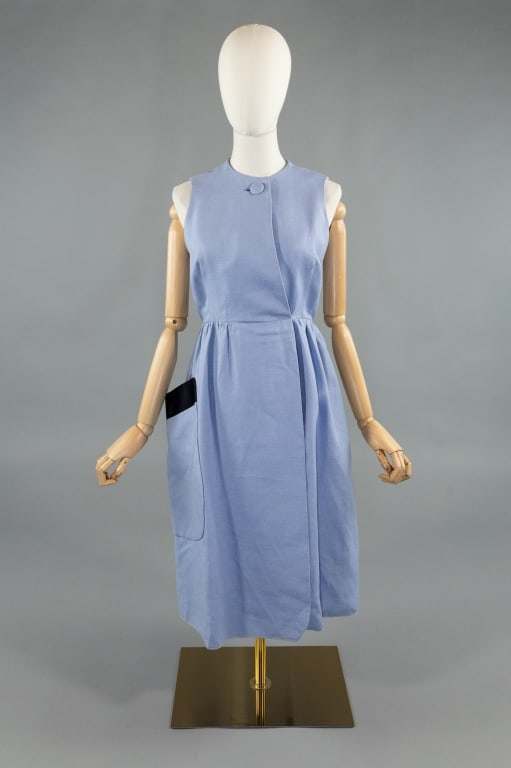 Vintage 1960s Geoffrey Beene Blue Linen Dress: Vintage 1960s Geoffrey Beene Blue Linen Sleeveless Mod Dress. Buttons at neck and hooks at waist to close with single large patch pocket at hip. Fully lined. Measures 36 inch bust, 30 inch waist, 41