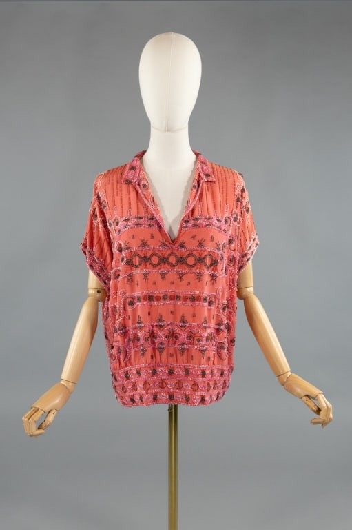 Antique 1920s House of Adair Pink Silk Beaded Top: Antique 1920s House of Adair Pink Silk Crepe Beaded Flapper Blouse Top. With v-neckline & fully beaded throughout. Snaps at side hem to close. Labeled House of Adair. Missing beads throughout as