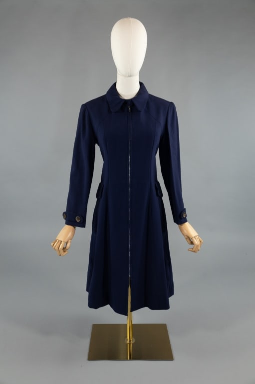 Vintage 1960s Jean Muir Blue Wool Crepe Coat Dress: Vintage 1960s Jean Muir Blue Wool Crepe Zip Front Mod Coat Dress. A-line shape with faux pocket flaps at hips. Buttons at cuffs and at back belt. Zips open at front. Fully lined. Labeled Jean Muir Hen