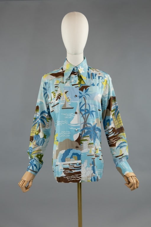 Vintage 1970s Lanvin Cotton Novelty Print Shirt: Vintage 1970s Lanvin Cotton Novelty Print Button Up Shirt. With all over print of sailboats and palm trees. Marked size 12. Missing one button on each cuff. Measures 20 inches flat across chest, 26