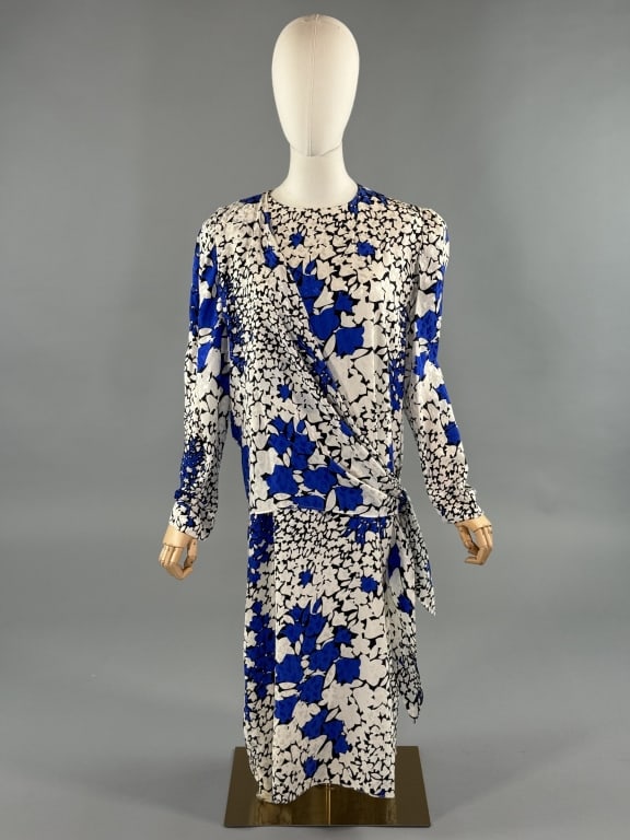 Vintage 1980s Guy Laroche Silk Floral Shift Dress: Vintage 1980s Guy Laroche Silk Floral Shift Dress. Zips at back to close with draped attached tie at waist. Loose, oversize fit. Fully lined. Marked size 44. Measures 40 inch bust, 45 inches long, 23