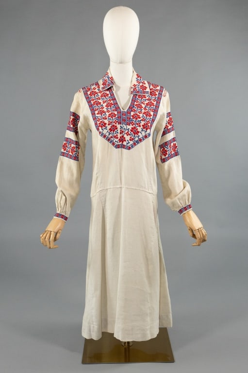 Antique 1920s Linen Floral Embroidered Folk Dress: Antique 1920s Linen Floral Embroidered Folk Dress. With red and blue floral embroidery at neck and sleeves. Light wear as shown throughout. Measures 36 inch bust, 34 inch waist, 44 inches long, 22