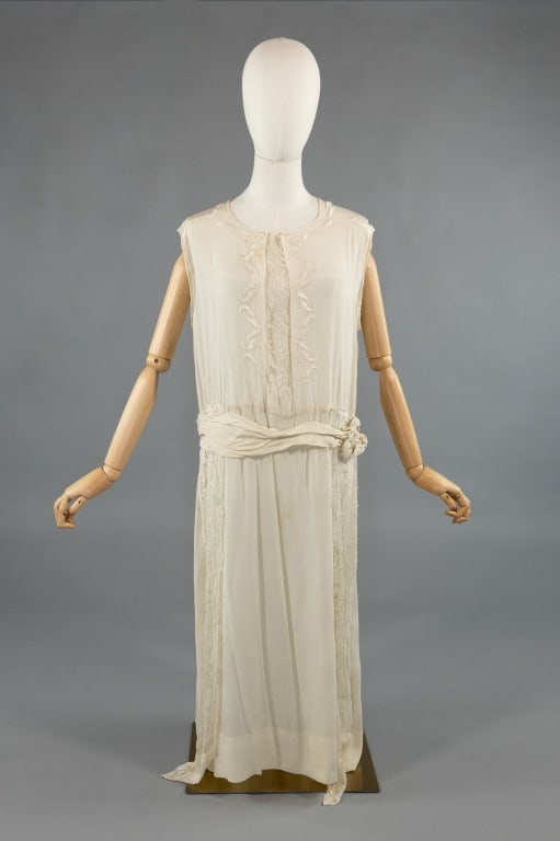 Vintage 1920s Ivory Silk Lace Beaded Wedding Gown: Vintage 1920s Ivory Silk Lace Beaded Flapper Wedding Gown. Embroidered and beaded at chest with lace details throughout. Light spots throughout as shown. Measures 40 inch bust, 36 inch waist, 45