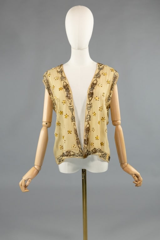 Antique 1920s Silk Embellished Bolero Vest Top: Antique 1920s Silk Embellished Bolero Vest Top. With sequin, beaded, prong set rhinestone, and floral shaped velvet details. Snaps closed at from hem with large glass rhinestone detail. Bead loss and