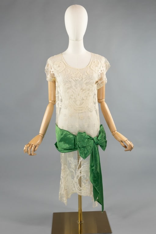 Antique 1920s Filet Lace Green Bow Flapper Dress: Antique 1920s Cotton Filet Lace Green Bow Flapper Shift Drop Waist Dress. Sleeveless dress with green bow belt at drop waist. Small floral detail at chest with rust stain, some also at hem as shown.