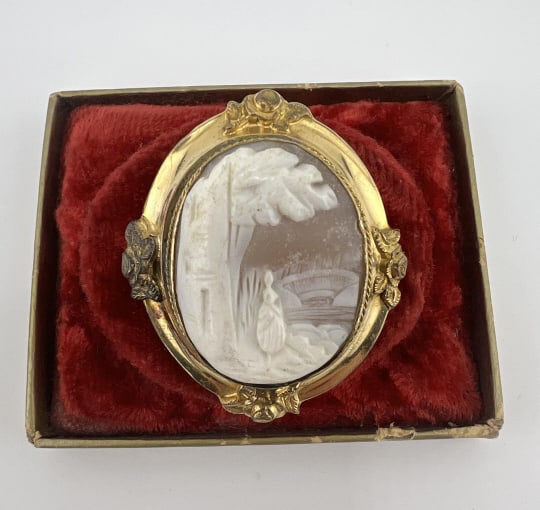 Antique 19th C Gold Fill Carved Shell Cameo Brooch: Antique 19th C Gold Filled Carved Shell Cameo Brooch. Hand carved natural shell cameo set in Victorian yellow gold filled frame with floral motif. Measures 1.75 inches in length.