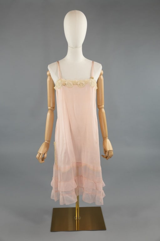 Antique 1920s Pink Silk & Lace Ruffle Slip Dress: Antique 1920s Pink Silk & Lace Ruffle Slip Dress Night Gown. With lace and floral ribbon details at bust. Silk ribbon straps with adjustable silk ribbon at bust. Tiered ruffled hem. Lace trimmed slits