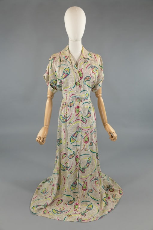 Vintage 1940s Rayon Paisley Printed Dress Gown: Vintage 1940s Rayon Paisley Printed Dress Zip Front Gown. With button closure at bust and zip at front waist down center front. Smocked through waistline. Light spotting throughout as shown. Measures