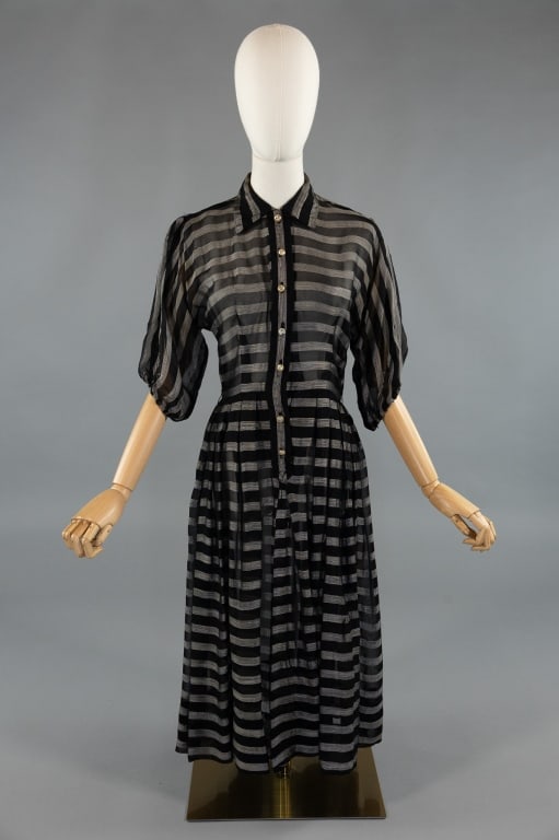 Vintage 1950s Striped Black Sheer Chiffon Dress: Vintage 1940s Rayon Paisley Printed Dress Gown. Closes at front with buttons. Short sleeves and dagger collar. Label in waist reads Bloomfield Junior. Light wear throughout as shown. Measures 34 inch