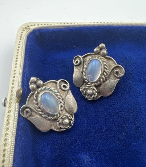 Antique Arts & Crafts Sterling & Moonstone Earring: Pair of Antique Arts & Crafts Sterling Silver & Cabochon Moonstone Earrings. Screw back supports. Hallmarked STERLING. Each measures 1 inch in length.
