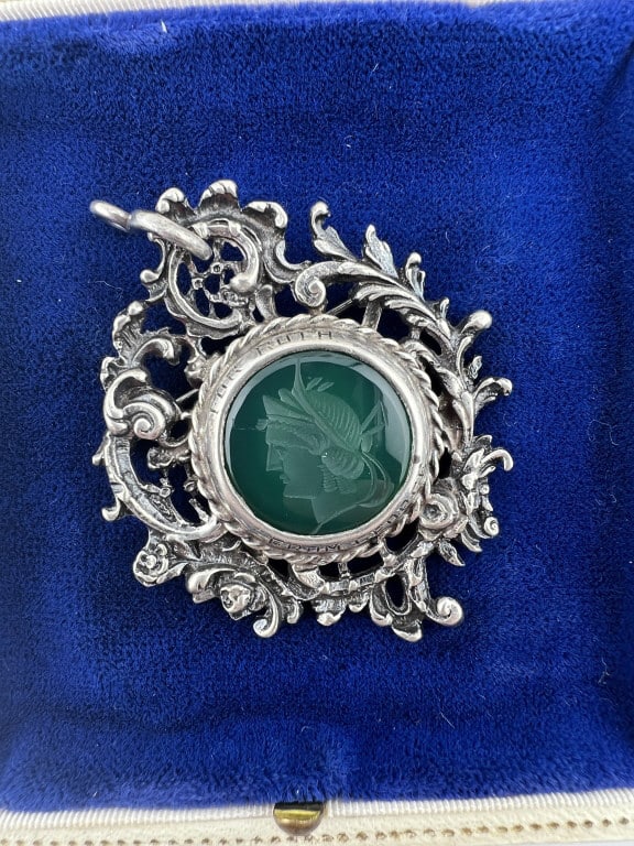 Antique Sterling & Green Agate Intaglio Pendant: Antique Sterling Silver & Carved Green Agate Intaglio Pendant. Ornate Rococo style sterling silver setting with hand carved Greco Roman style green agate / onyx intaglio. Hallmarked STERLING on the ba