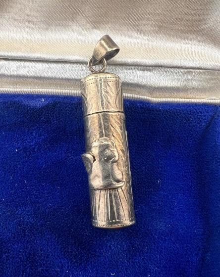 Vintage Sterling Silver Cupid Flask Pendant: Vintage Sterling Silver Cupid Flask Pendant. Sterling silver, hinged flask pendant with gold wash interior, featuring a cherub in the style of the painting by Rafaello entitled "La Madonna Sixtina." H