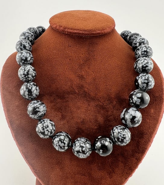 Sterling Silver Snowflake Obsidian Necklace Strand: Sterling Silver Snowflake Obsidian Necklace Strand.Hand knotted on black silk thread with approximately 12 mm snowflake obsidian beads and mounted with sterling silver caps, clasp, and spring ring. Me