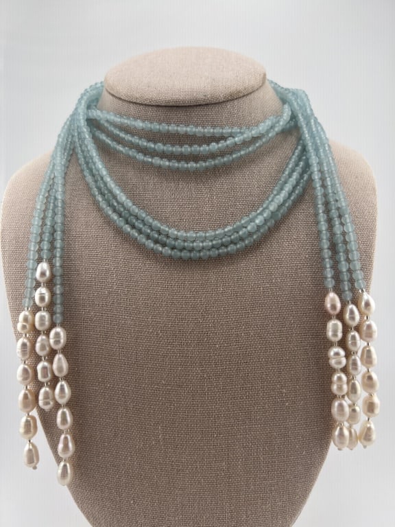 Three Strand Carved Aqua Bead & Pearl Necklace: Three Strand Carved Aqua Bead & Pearl Necklace. Can be worn as a lariat or knotted and worn as a necklace. Set with cultured baroque pearls. Each measures approximately 50 inches in length. Beads test