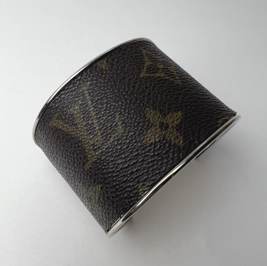 Louis Vuitton Monogram Fabric Cuff Bracelet: Louis Vuitton Monogram Fabric Cuff Bracelet. Authentic Louis Vuitton fabric cut and mounted onto cuff form. Bracelet measures approximately 2.75 inches across the interior opening.