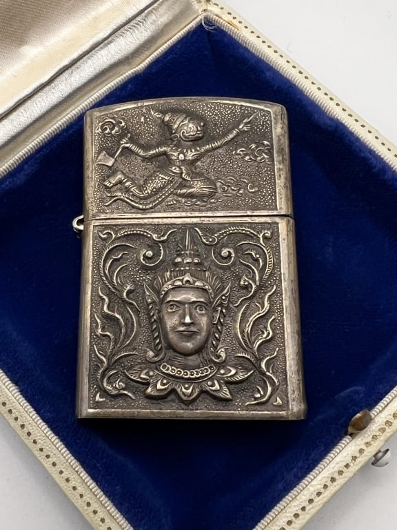 Vintage Sterling South East Asian Lighter Case: Vintage Sterling South East Asian Lighter Case / Vesta Case. Marked STERLING MADE IN SIAM on the bottom. Repousse and chased scene of an elephant on one side and Buddha on other. Measures 2.25 inches