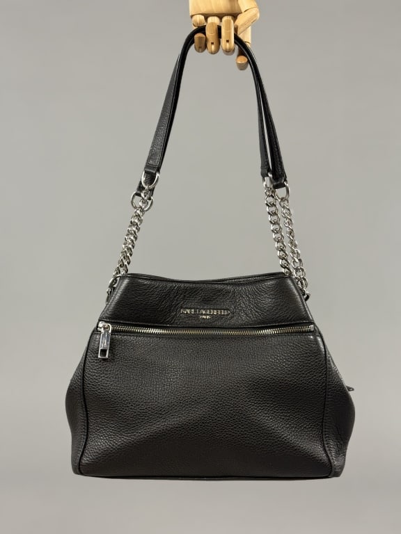 Karl Lagerfeld Paris Leather Purse w Dust Cover: Karl Lagerfeld Paris Leather Purse w Dust Cover. Black pebble grain leather with silver hardware. Comes with original dust cover. Both purse and cover are branded. Body of purse measures approximately