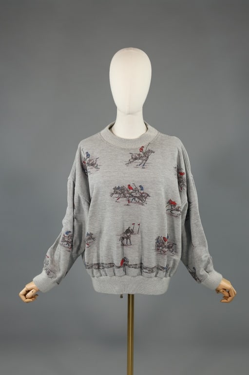 Vintage 1990s Gucci Polo Horse Print Sweatshirt: Vintage 1990s Gucci Polo Horse Print Sweatshirt having all over print of polo horse players with ribbed neck, hem, and sleeve cuffs. Small holes at front as shown. Marked size XL - measuring 26 inches