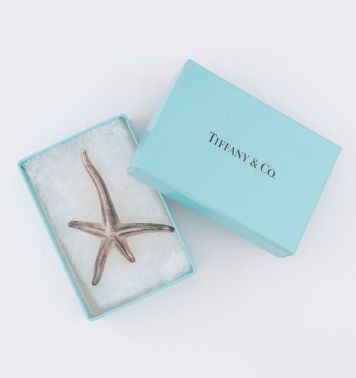 Tiffany & Co Elsa Peretti Sterling Starfish Brooch: Tiffany & Co Elsa Peretti Sterling Silver Starfish Brooch. Comes with original box. Signed / hallmarked on the back. Measures 2.5 inches in length.