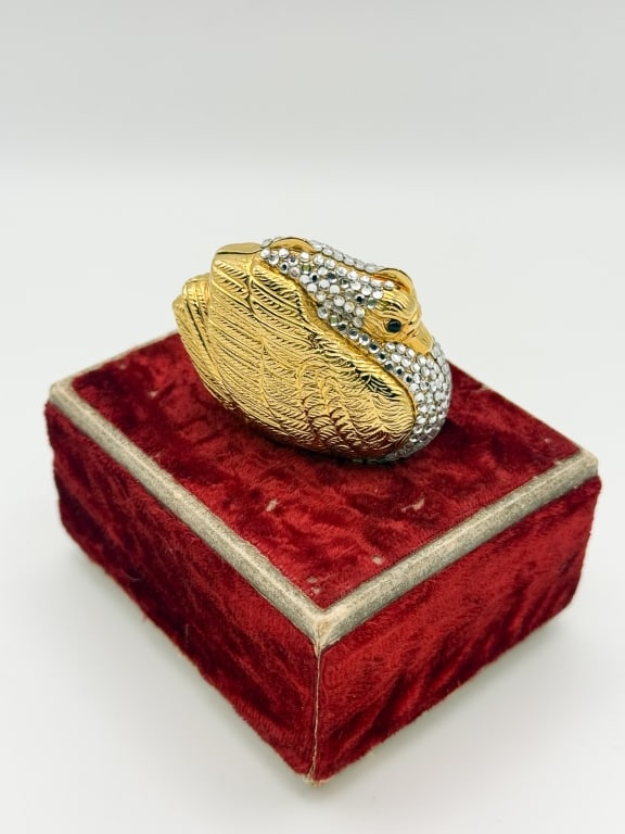 Judith Leiber Crystal Swan Miniaudiere Pill Box: Judith Leiber Crystal Swan Miniaudiere Pill Box having Swarovski crystal details and gold tone throughout. Kiss lock closure at top with hinged bottom. Marked inside. Comes with original box and dust