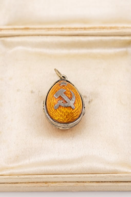 Estate Russian Silver & Enamel Egg Locket Pendant: Estate Russian Silver & Enamel Egg Locket Pendant. Silver, yellow enamel locket necklace pendant or charm Faberge egg style. Measures 1 inch in length.
