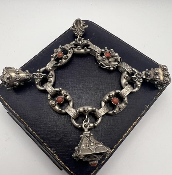 Antique Etruscan Revival 800 Silver Coral Bracelet: Antique Etruscan Revival 800 Silver & Coral Bracelet. Charm bracelet. Articulated panel bracelet with cannetille wire work in the Archaeological Revival style, clasp is hallmarked 800, alternating lin