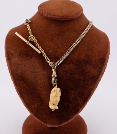 Antique 19th C Yellow Gold Filled Chain w Owl: Antique 19th C Yellow Gold Filled Watch Chain w Carved Bone Owl Pendant. Chain with dog clip, spring ring and T bar. Curb link design and rolo link extender. Measures just under 16 inches in length.