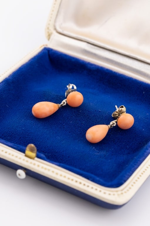 Pair Antique 19th C Coral Pendant Drop Earrings: Pair Antique 19th C Coral Pendant Drop Earrings in Silver Settings. Each measures approximately 1 inch in length. Natural color showing color variation.
