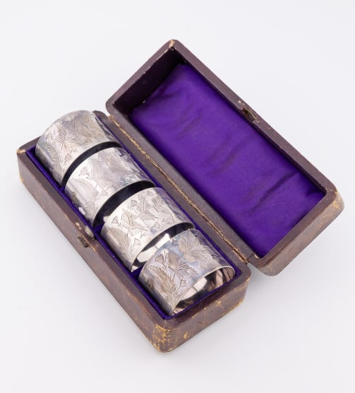 Antique 19th C Silver Napkin Rings in Fitted Box: Antique 19th C Silver Napkin Rings in Fitted Box. Apparently unmarked, likely silver plate or quadruple plate. Napkin rings are just over 1.5 inches in diameter, box measures 5.5 inches in length.