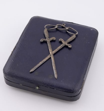 Antique 19th C Silver Odd Fellow Fraternal Pendant: Antique 19th C Silver Odd Fellow Fraternal Pendant. Cross swords and triple link Odd Fellows motif at the top with bail for chain or sash. Low grade silver or silver plated. Measures 3.5 inches in len