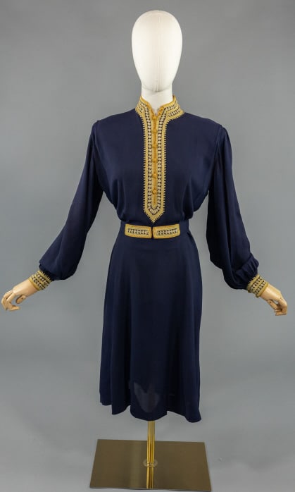 Vintage 1930s Blue Chiffon Embroidered Folk Dress: Vintage 1930s Blue Chiffon Embroidered Folk Dress having crochet trim details throughout, removable belt at waist, zips at side to close and buttons at neck. Measuring 40 inch bust, 30 inch waist, 40