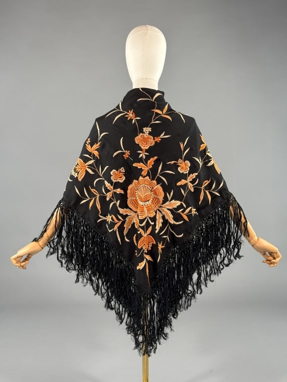 Vintage 1930s Rayon Floral Embroidered Piano Shawl: Vintage 1930s Rayon Floral Embroidered Piano Shawl Wrap Scarf having embroidered florals and macrame fringed edges. Holes throughout and wear as shown. Measuring approximately 45 inches by 43 inches w