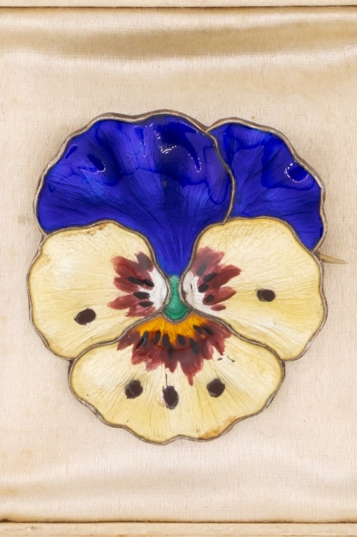 Antique Sterling Silver Enamel Pansy Flower Brooch: Antique Sterling Silver Enamel Pansy Flower Brooch. Hallmarked on the back 925 S with a small symbol. Hand painted multi color enamel decorated. Measures just over 1.25 inches in length.