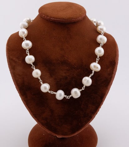 Sterling Silver & Cultured Baroque Pearl Necklace: Sterling Silver & Cultured Baroque Pearl Necklace. Necklace with slightly varying high luster white baroque pearls of approximately 6 to 8mm in size, with sterling silver wire handmade settings, sterl
