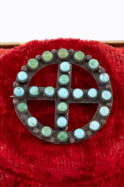 Antique Round Silver Turquoise Cross Motif Brooch: Antique Round Silver Turquoise Cross Motif Brooch. Set with cabochon green and Persian blue tone turquoise stones. Measures just over 1 inch in diameter.