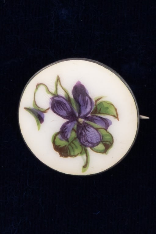 Antique Sterling Silver & Enamel Flower Brooch: Antique Sterling Silver & Enamel Flower Brooch. Hallmarked 925 S on the back with small symbol. Hand painted floral motif in enamel. Measures approximately 1 inch in diameter.