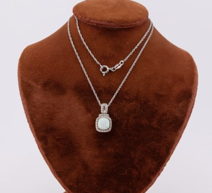 Sterling Silver & Opal Necklace Pendant on Chain: terling Silver & Opal Necklace Pendant on Chain. Both the chain and the pendant are hallmarked for sterling silver. The chain measures 18 inches in length, the pendant measures approximately .75 of an